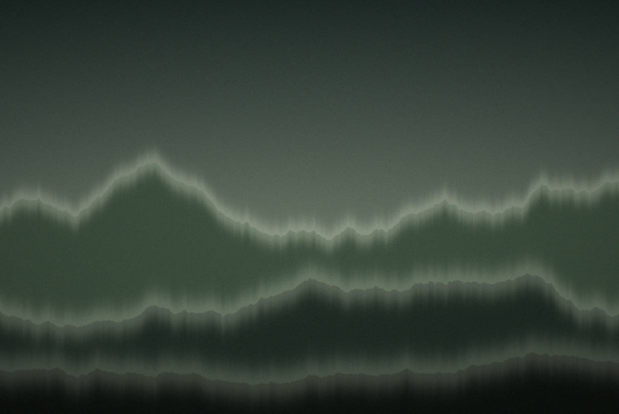 Green ridgelines receding into haze